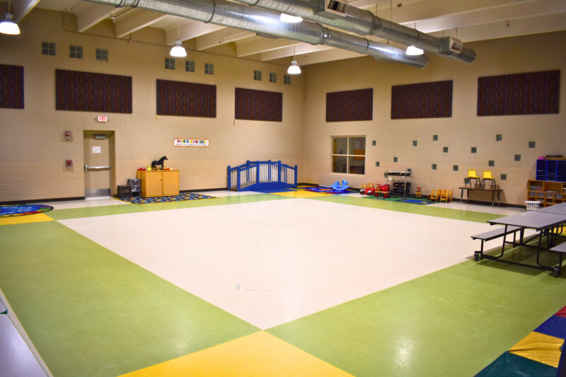 Colorful with colorful floor, table, and equipment.