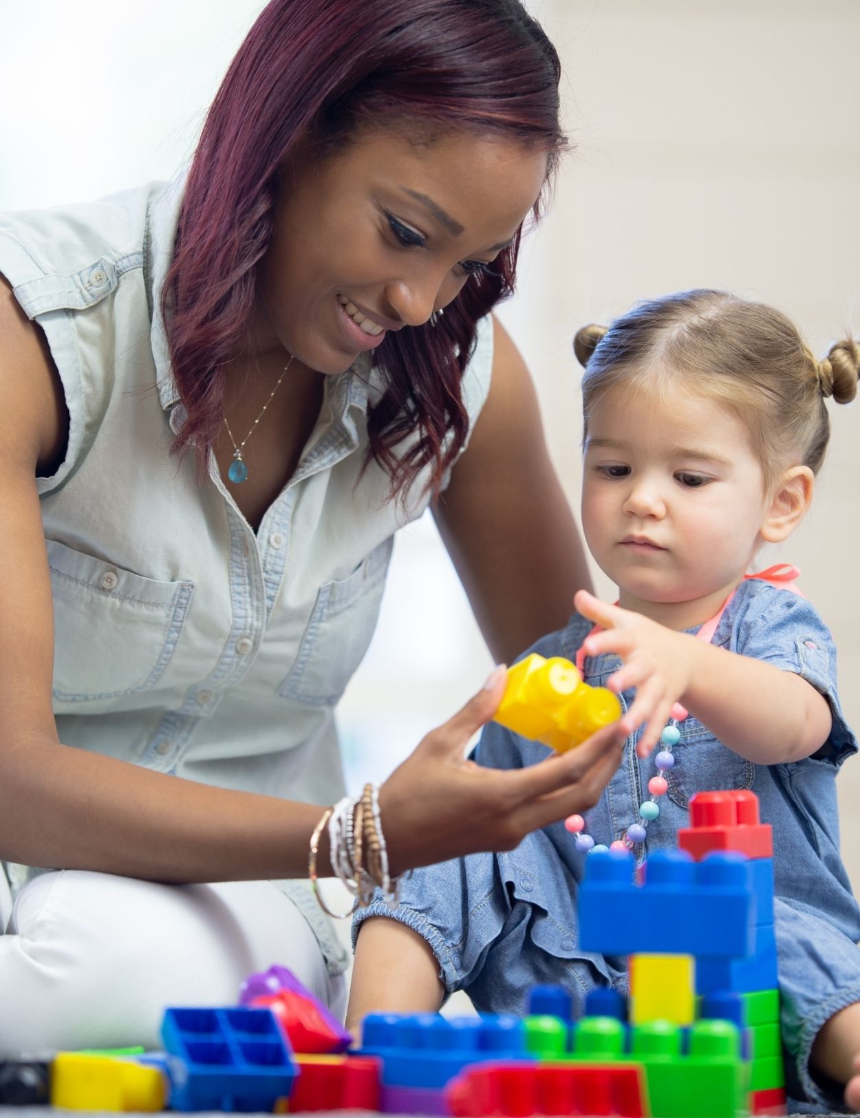 Women playing with a child