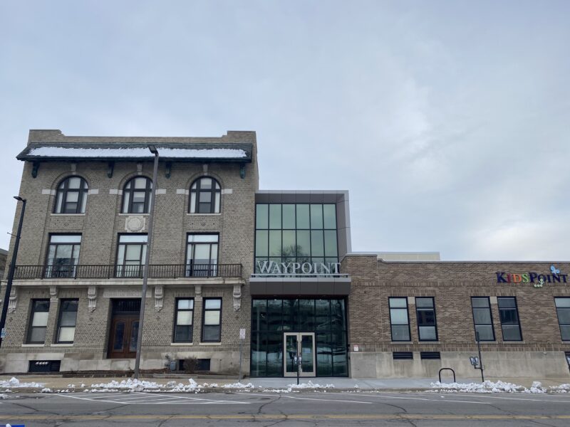 KidsPoint Downtown building with brick exterior and large windows.